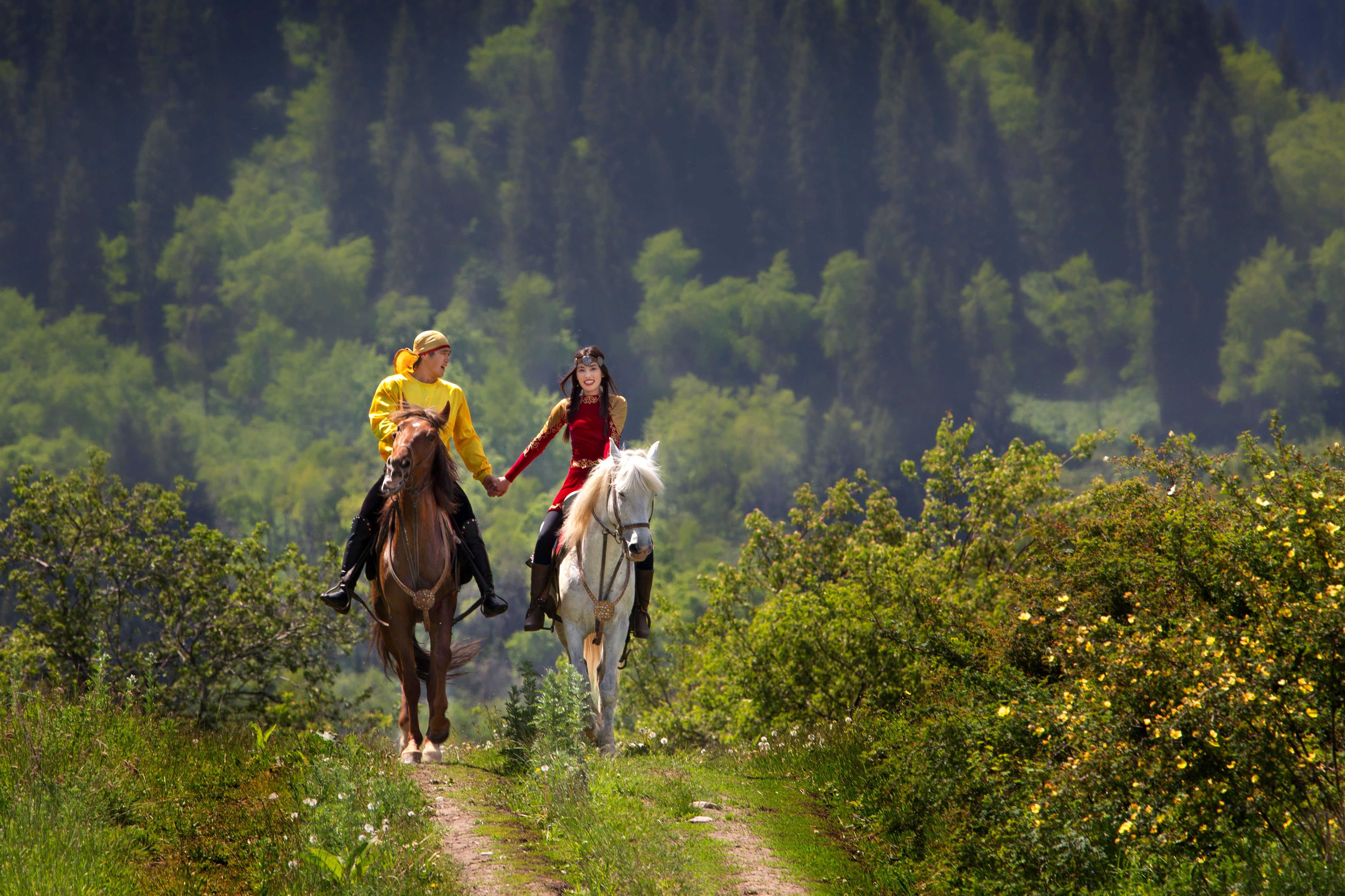 Kazakh couple on the horse, Almaty, Kazakhstan